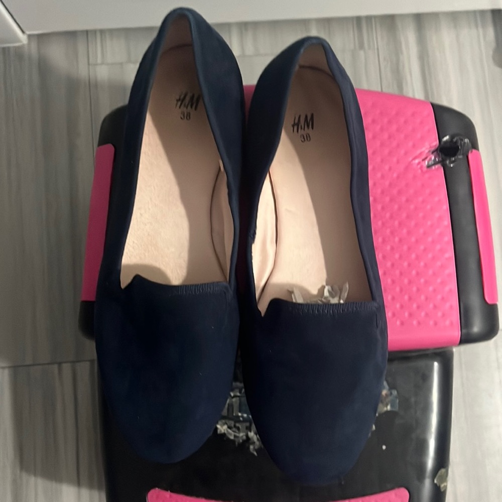Flat navy blue loafers.  Slightly love no real signs of wear.